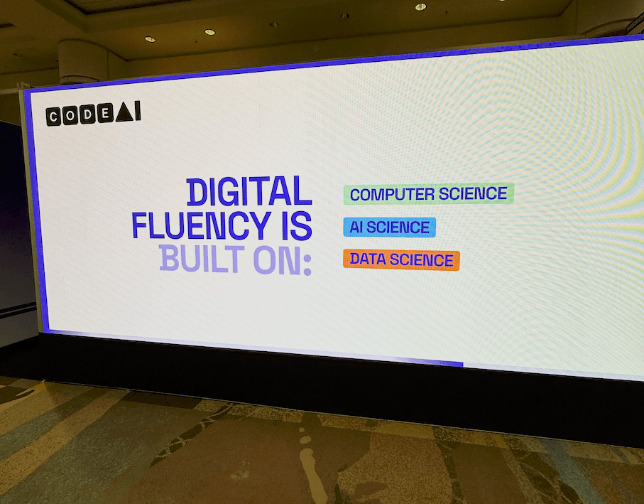 Large CodeAI display at ISTELive 26 that reads Digital Fluency Is Built On: Computer Science, AI Science, and Data Science